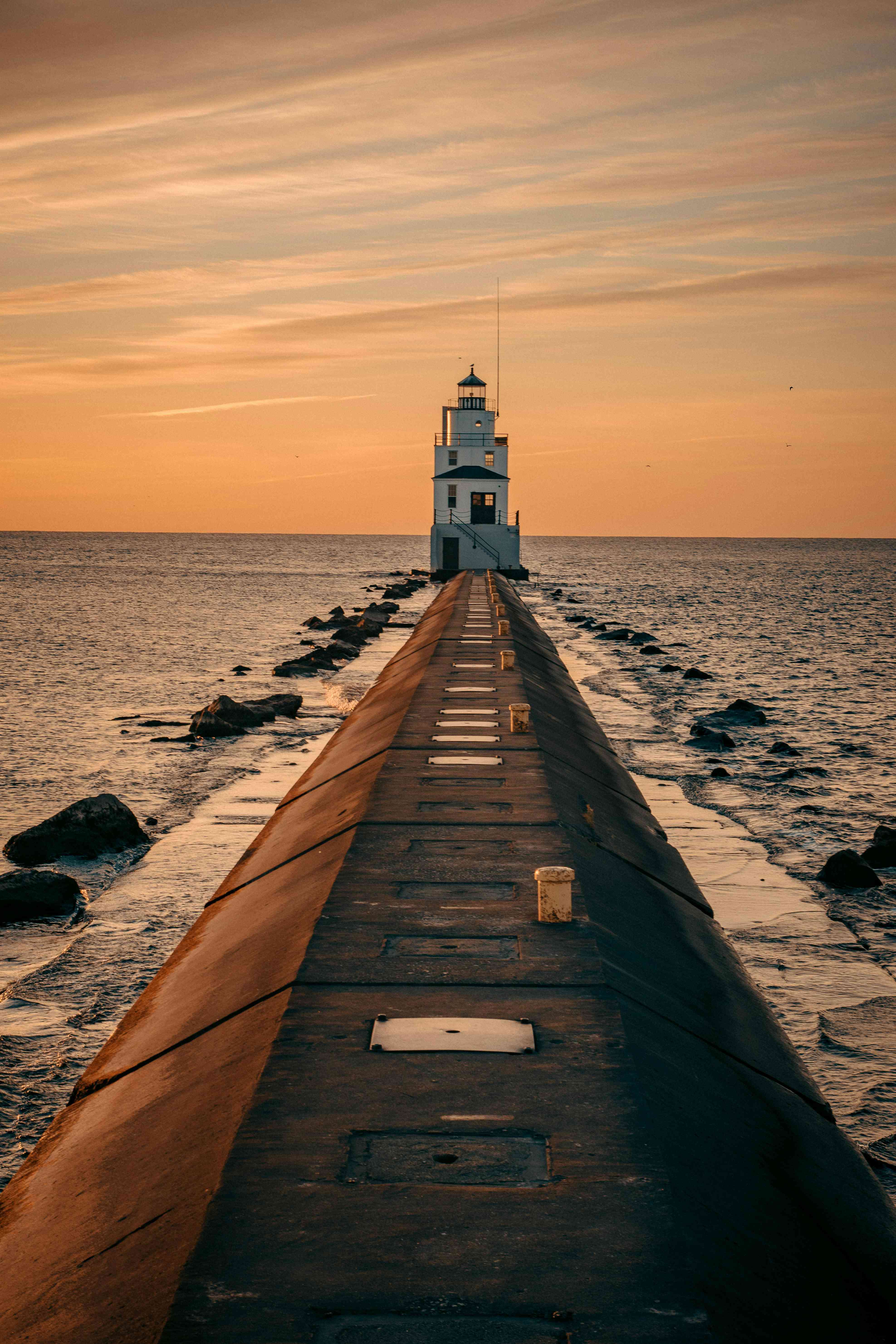 Sunset Lighthouse Wallpaper 4K - Ocean Path Mobile Lockscreen | MirrorLog